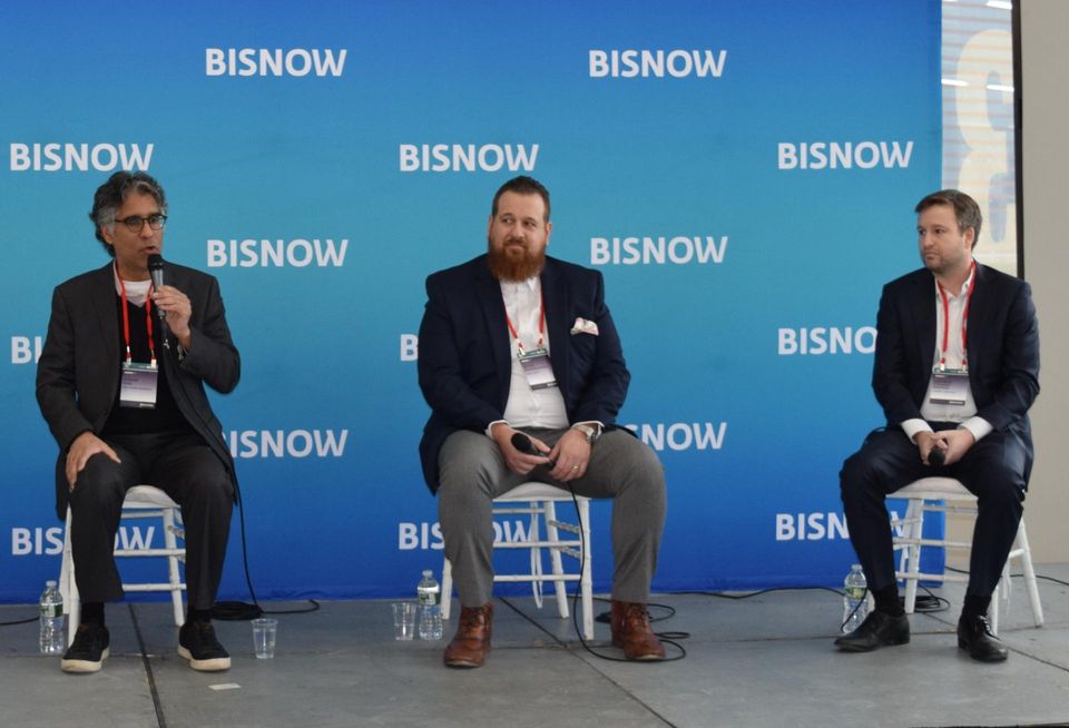 First Pioneer Properties' Suresh Sani, Vorea Group's Peter Papamicheal and Charney Co.'s Andrew Steiker-Epstein on stage at Bisnow's 2023 Long Island City and Queens State of the Market event.