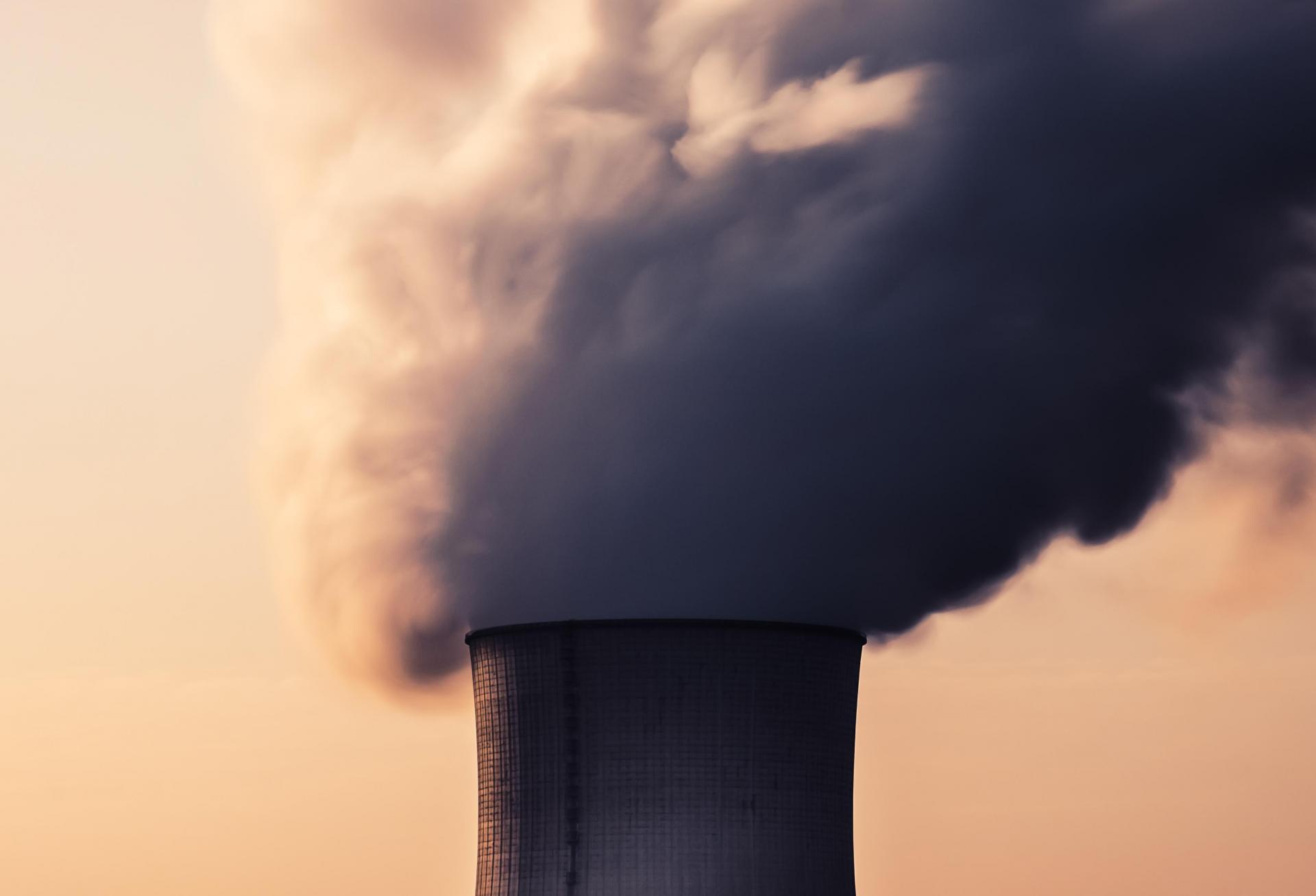 Smokestack with billowing smoke. 