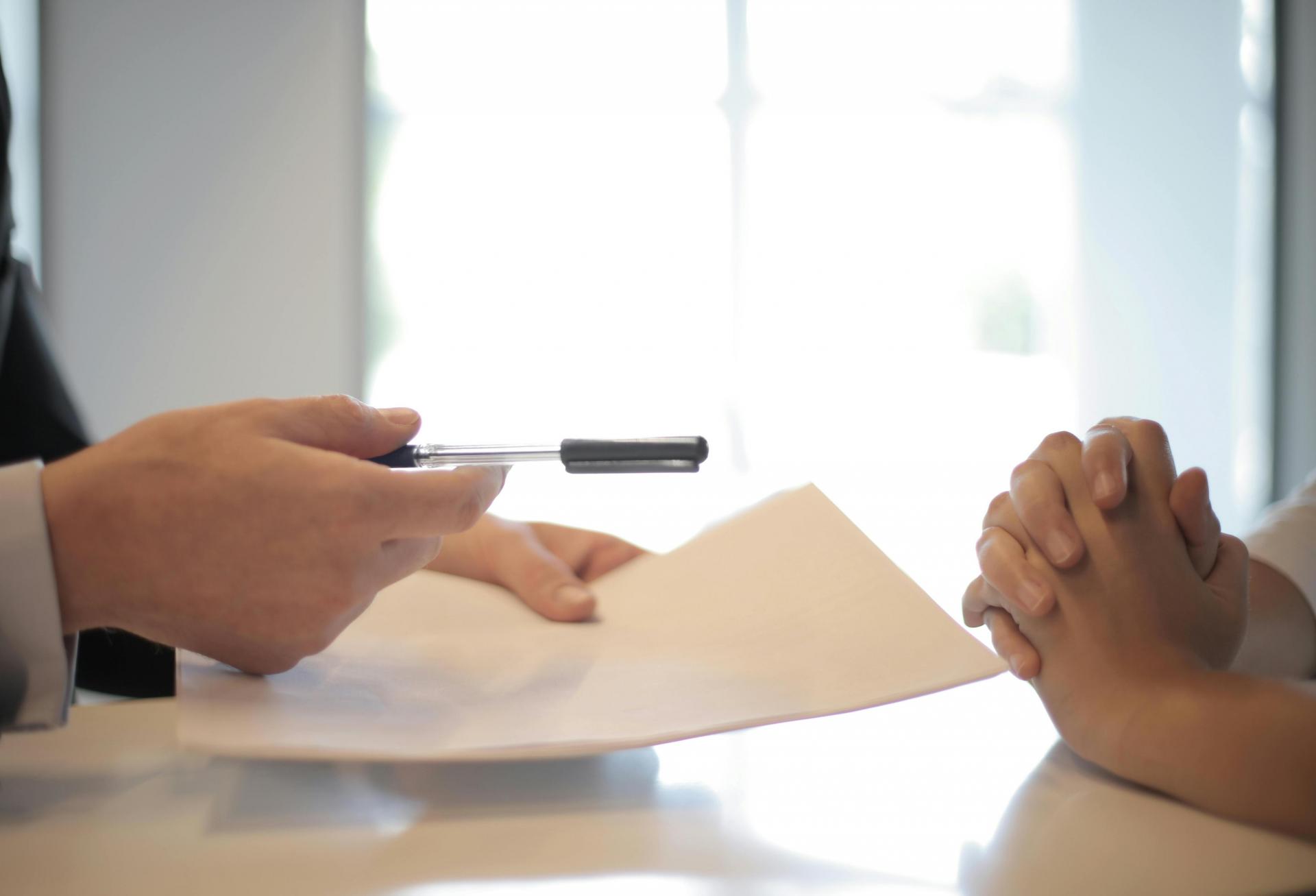 Photo of someone signing a contract