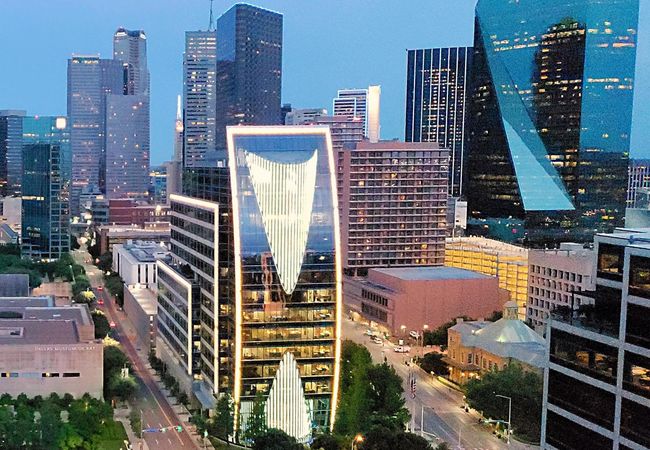 Klyde Warren Park and Dallas skyline at twilight.