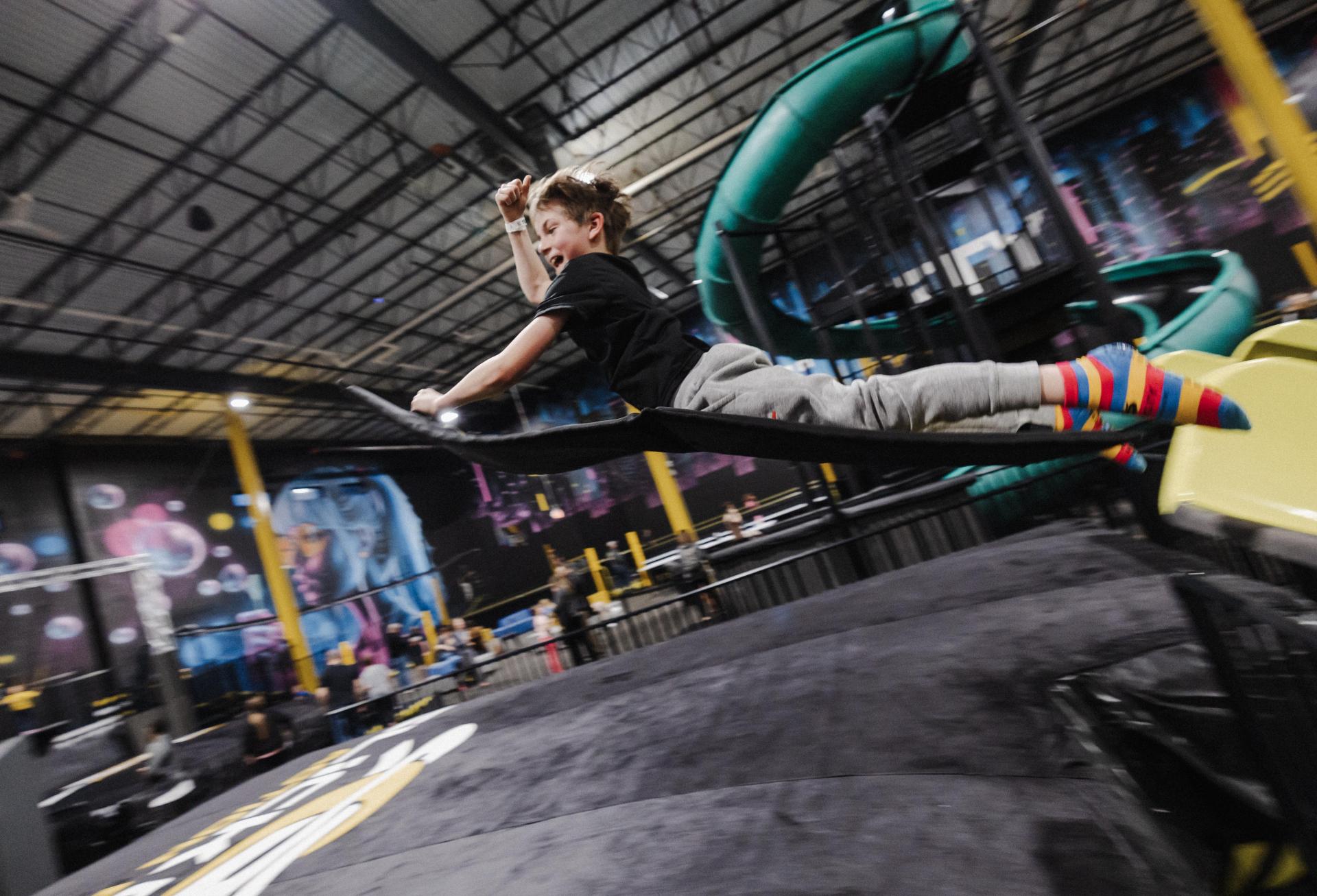 A child flying off a slide