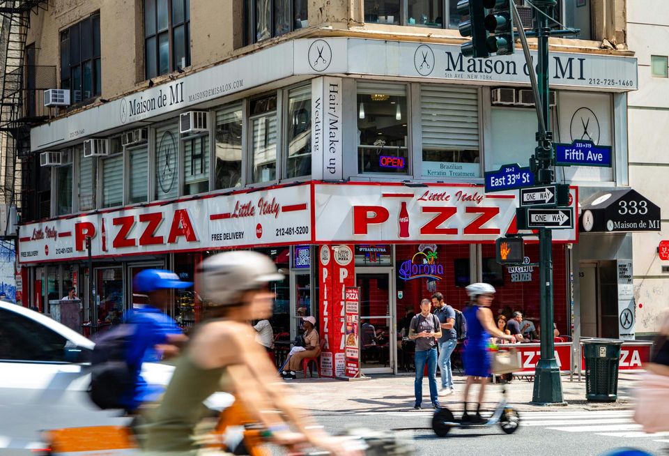 A takeout pizza slice retailer in Little Italy, New York City.