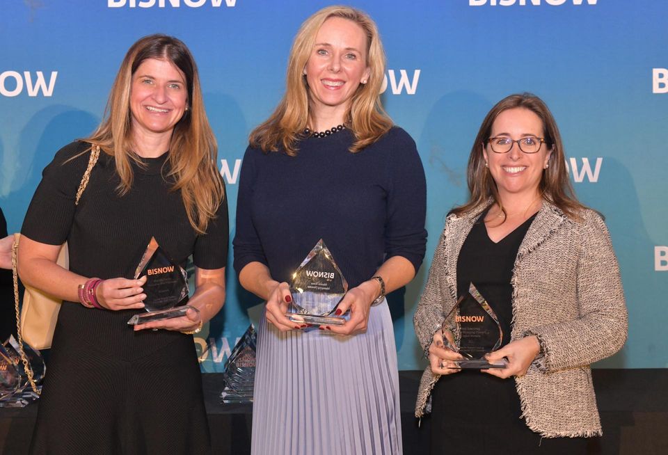 Winners of the Brokerage award, Newmark’s Marcella Fasulo, JLL Capital Markets’ Marion Jones and JLL’s Brett Rosenberg onstage at Bisnow's 2023 New York Women Leading Real Estate event.
