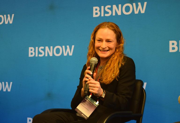 SHOPCORE Properties' Jessica Zaski on stage at Bisnow's 2023 national retail event.