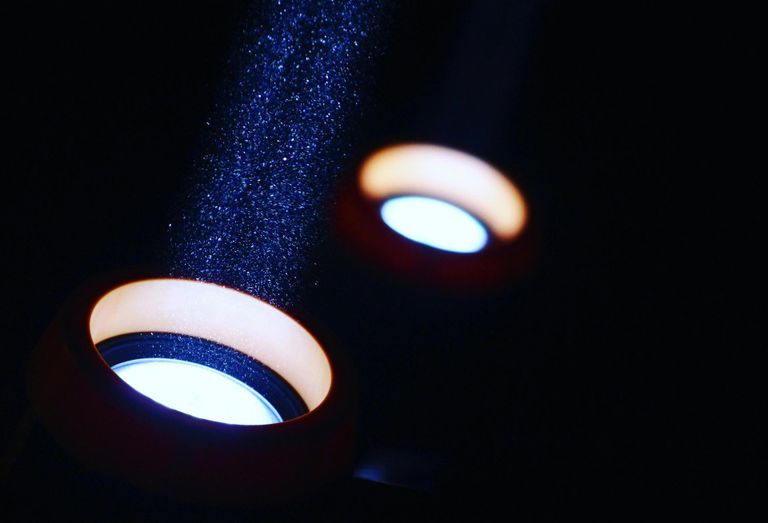 Two spotlights pointed in upward angle