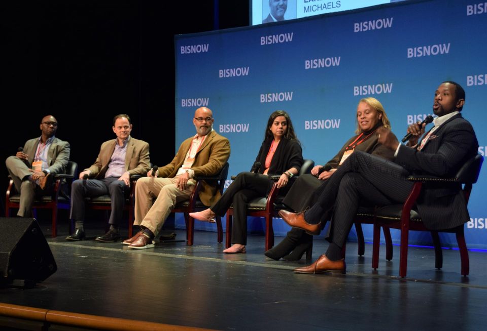 DMPED's Tim White, D.C. Sports and Entertainment Division's Ralph Morton, The Michaels Development Co.'s Christopher Early, Whitman-Walker's Naseema Shafi, Anacostia BID's Kristina Noell and Building Bridges Across the River's Rahsaan Bernard speak during a panel at Bisnow's Future of Wards 7 and 8 event on Dec. 13, 2022.