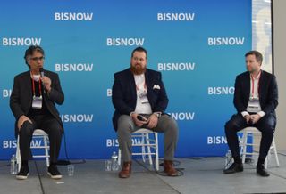 First Pioneer Properties' Suresh Sani, Vorea Group's Peter Papamicheal and Charney Co.'s Andrew Steiker-Epstein on stage at Bisnow's 2023 Long Island City and Queens State of the Market event.