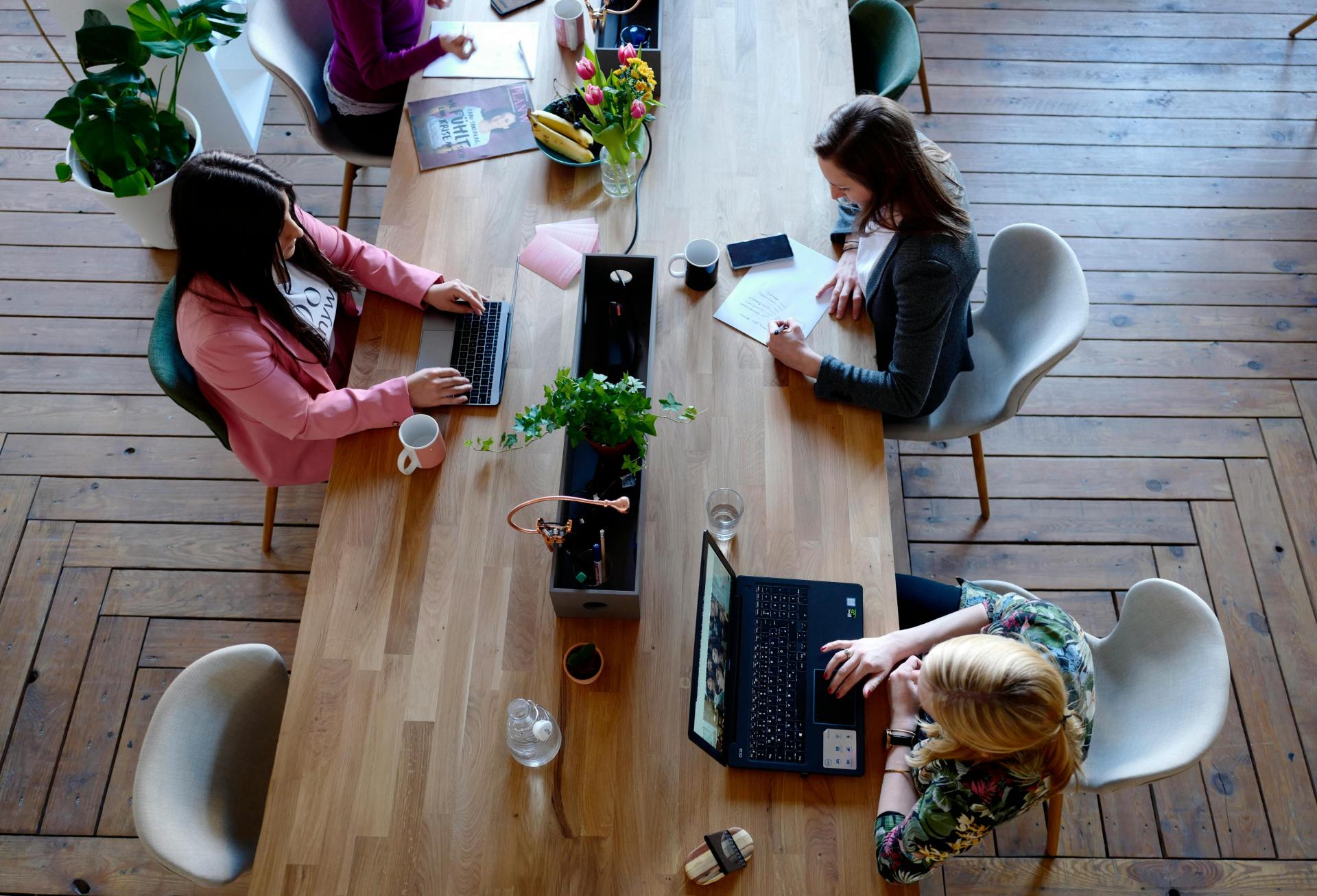 Coworking space table workers women working
