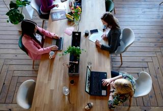 Coworking space table workers women working