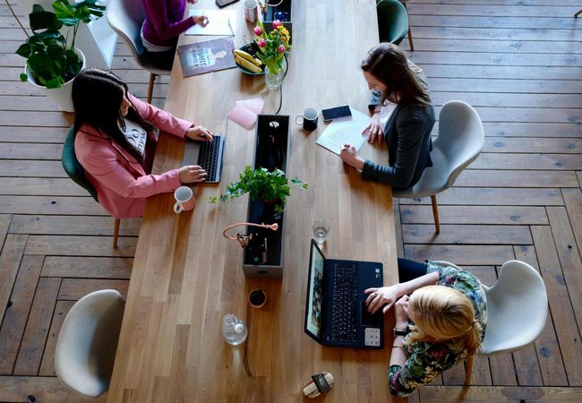 Coworking space table workers women working