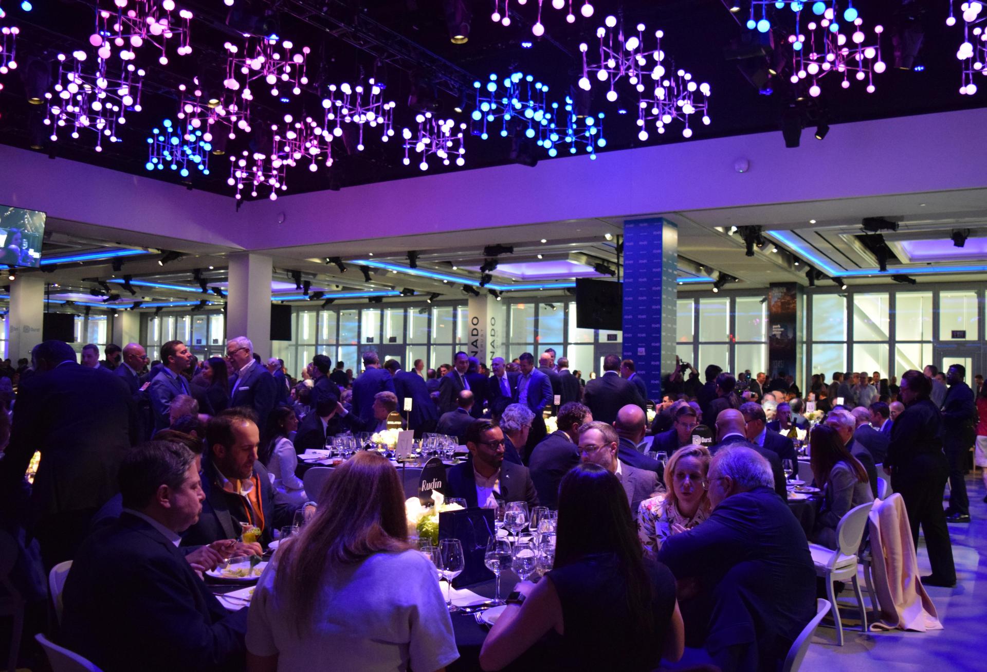 Guests seated for the awards ceremony and dinner at REBNY's 127th annual gala, held in the Hell's Kitchen Glasshouse venue overlooking the Hudson.