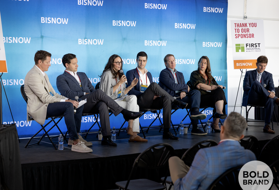 A high-resolution photograph of a panel at Bisnow's industrial event.