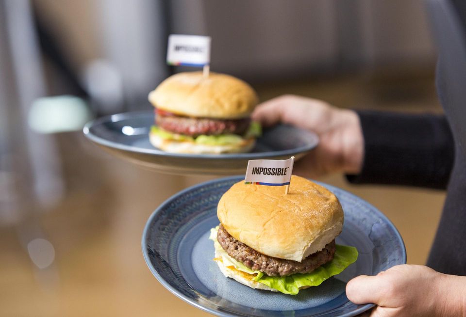 A pair of Impossible Foods plant-based hamburgers