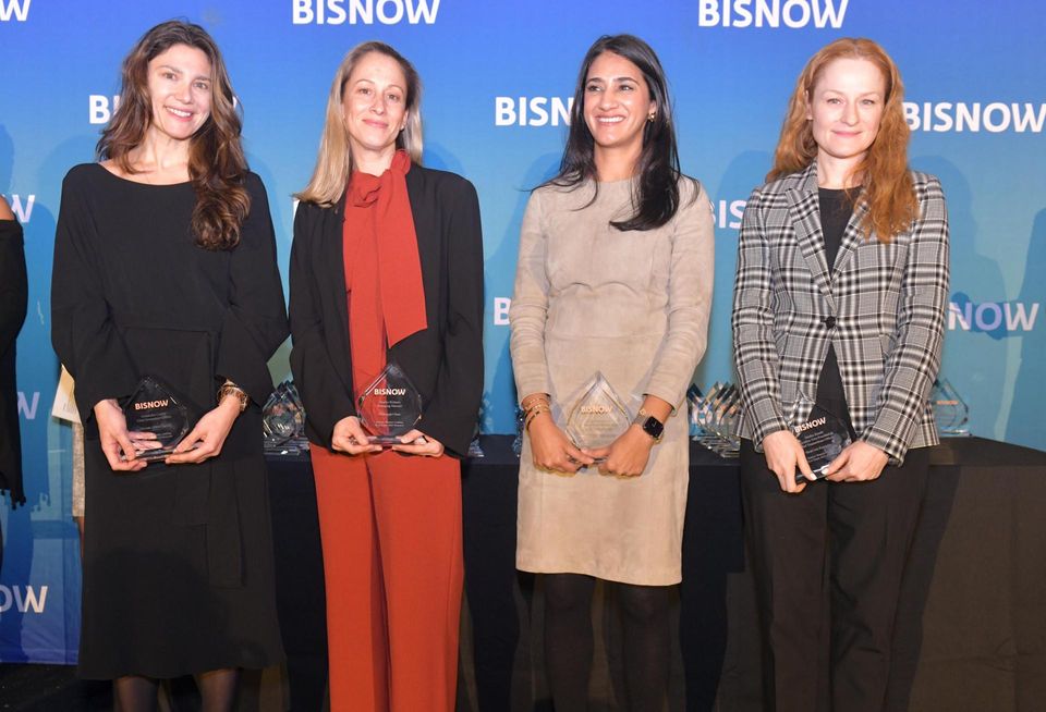 Winners of the Leadership award, Nuveen Green Capital’s Alexandra Cooley,  JPMorgan Chase’s Brooke Richartz, Cerberus Capital’s Neha Santiago and SHOPCORE Properties’s Jessica Zaski, onstage at Bisnow's 2023 New York Women Leading Real Estate event.