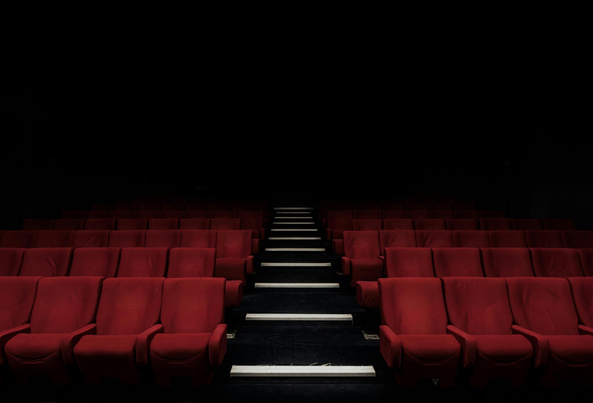 An empty movie theater image from Unsplash