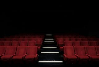 An empty movie theater image from Unsplash