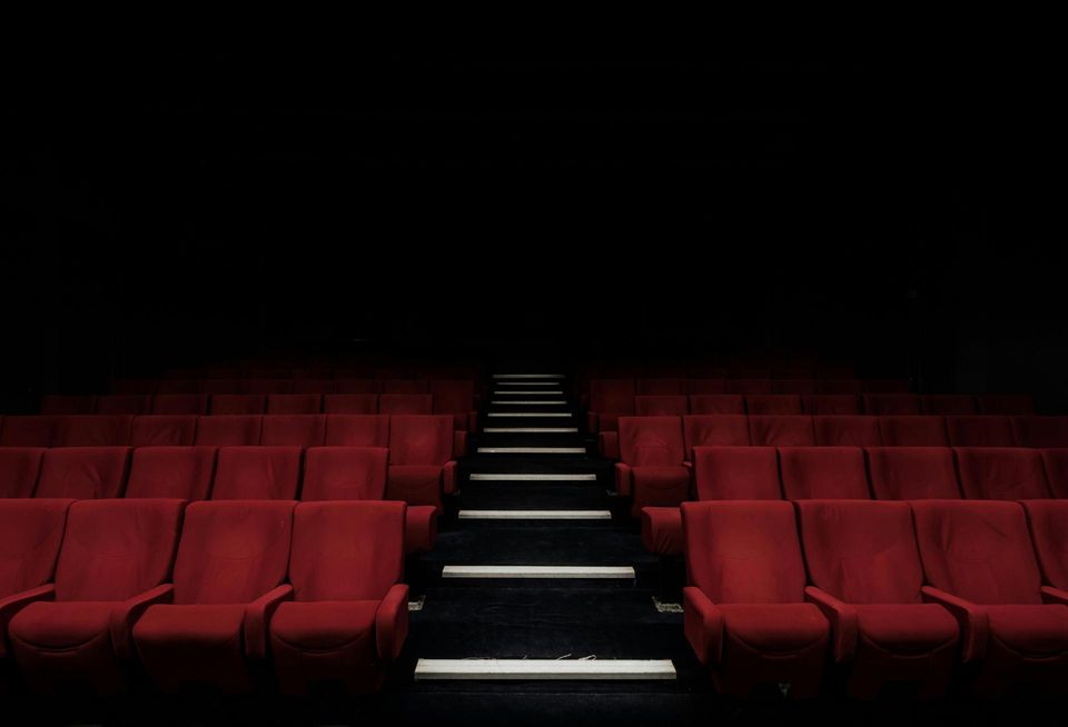 An empty movie theater image from Unsplash