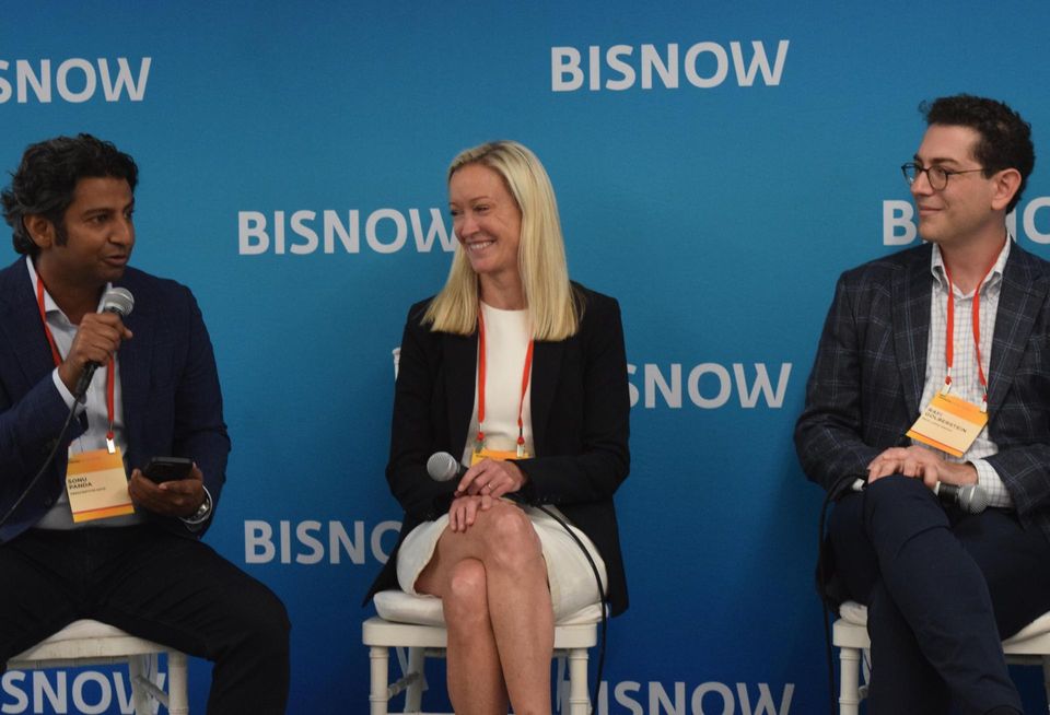 Prescriptive Data's Sonu Panda, Nuveen Green Capital's Jessica Bailey and PACE Loan Group's Rafi Golberstein on stage at Bisnow's National Finance Summit in 2022.