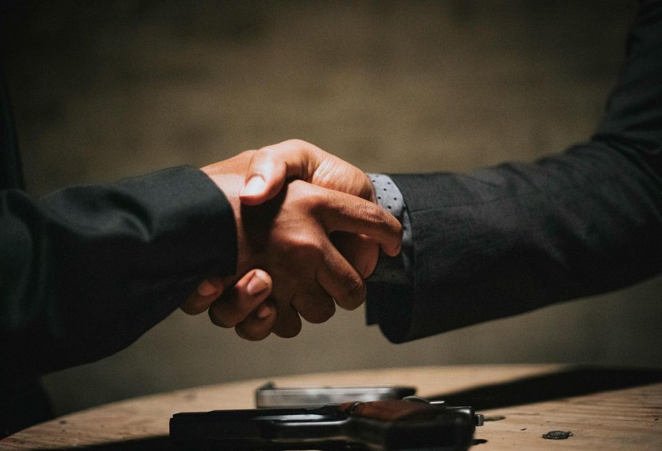 handshake dark background
