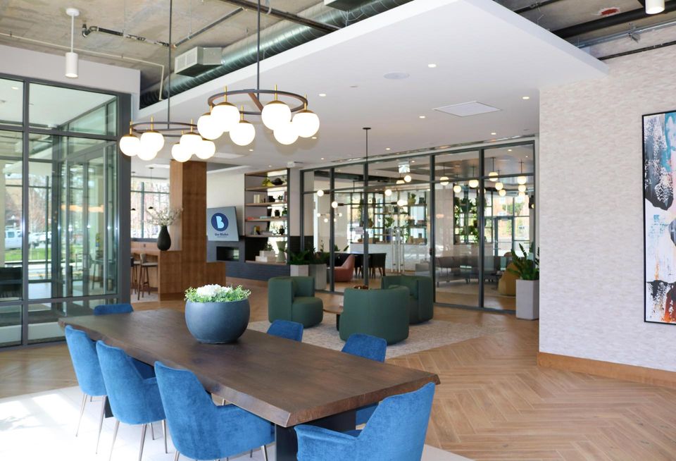 Clubroom area of The Blake, featuring table and group seating