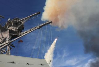 The USS Thomas Hudner fires a Tomahawk land attack missile during Operation Epic Fury in the U.S. Central Command area of responsibility, March 21, 2026.