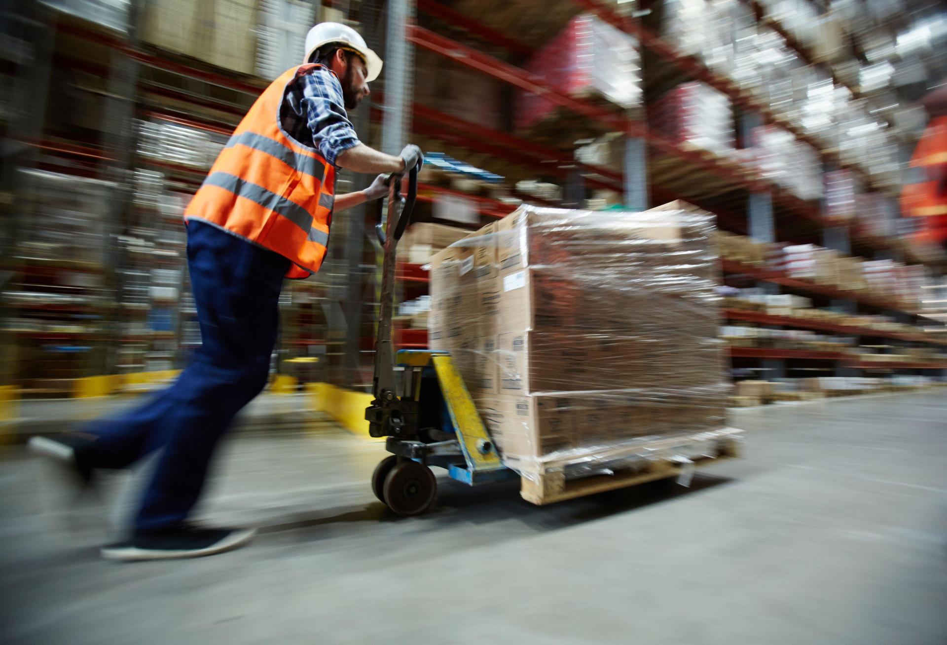 Man in warehouse with scissor lift