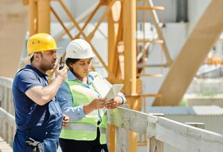 Two professionals on a job site
