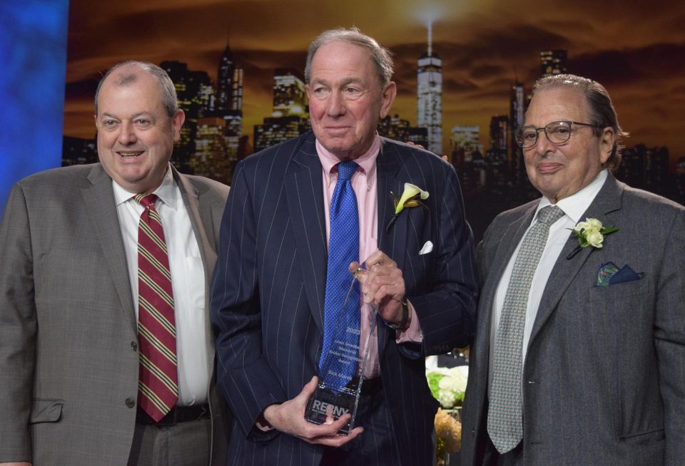 REBNY's Whelan (L) and Durst (R) presenting Helmsley Spear Vice Chairman Rick Marek with the Louis Smadbeck Memorial Broker Recognition Award.