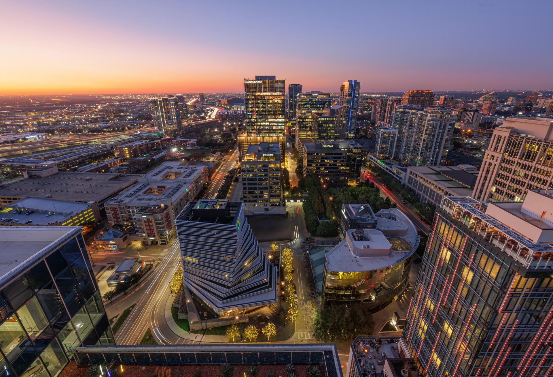 Nighttime aerial view of the Harwood District in DFW.