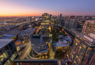 Nighttime aerial view of the Harwood District in DFW.