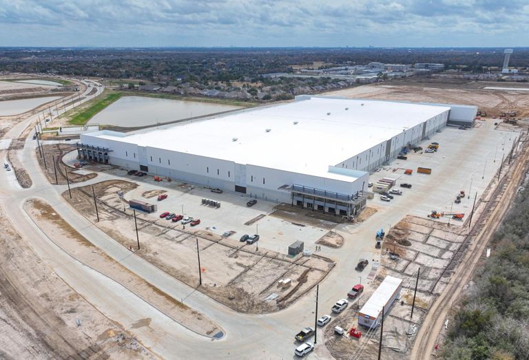 An aerial view of a newly built industrial warehouse 
