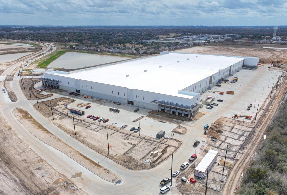 An aerial view of a newly built industrial warehouse