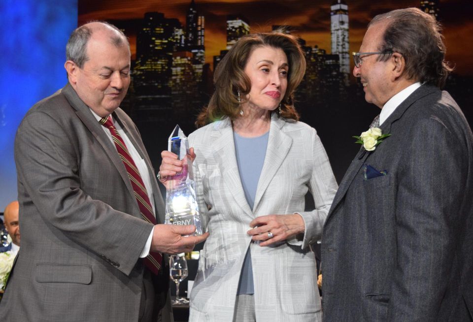 REBNY president Jim Whelan (L) and chair Douglas Durst (R) presenting the Harry B. Helmsley Distinguished New Yorker Award to Mary Ann Tighe (center), CBRE CEO of New York Tri-State Region.
