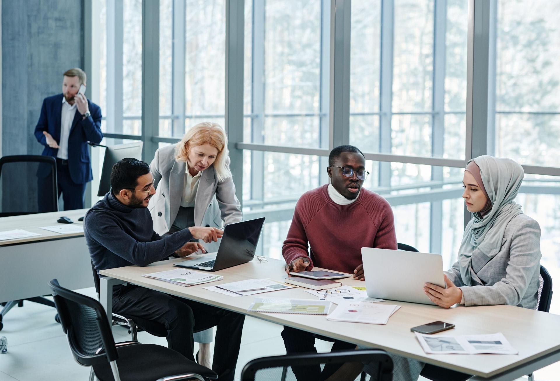 A group of people working in an office space.