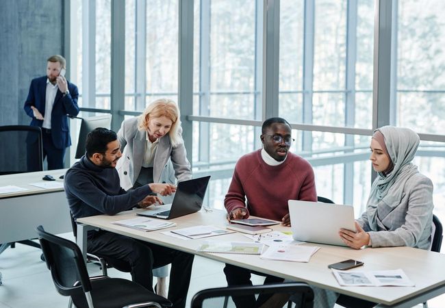 A group of people working in an office space.