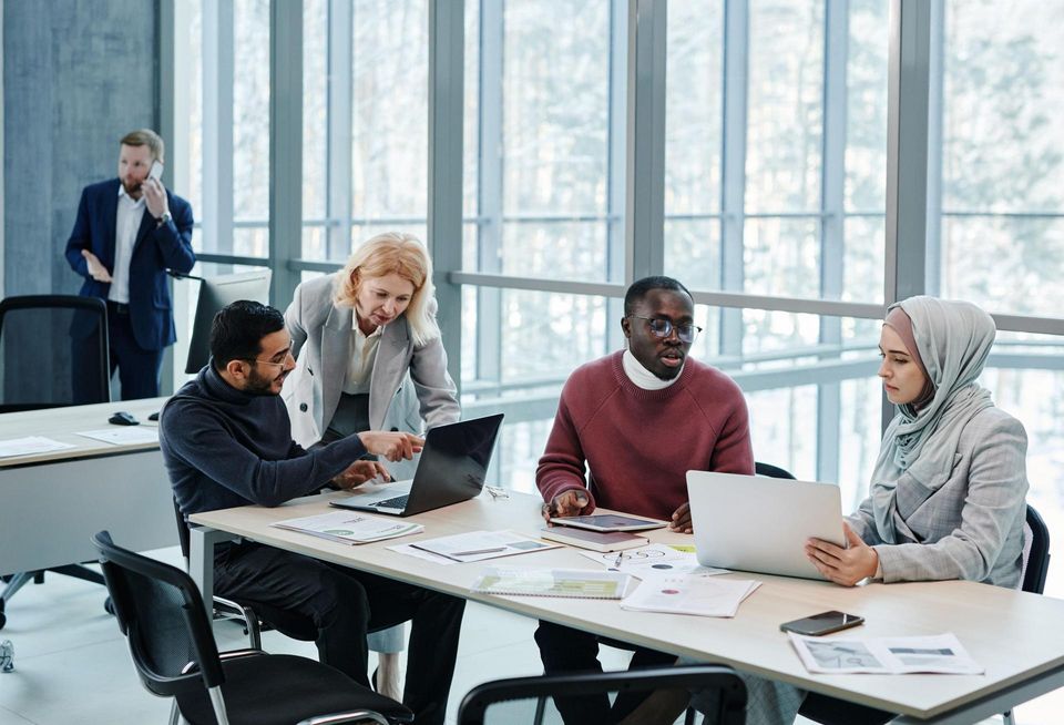 A group of people working in an office space.