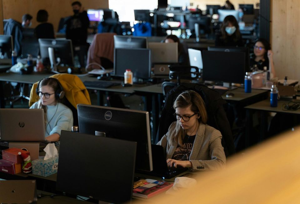 People Sitting in an crowded office
