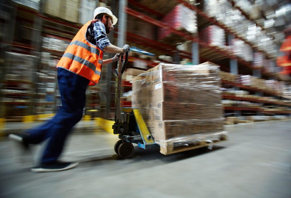 Man in warehouse with scissor lift