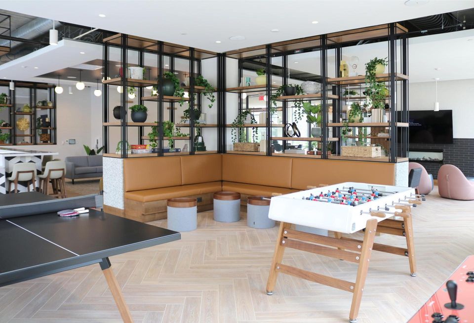 Gaming area at The Blake featuring a foosball and ping pong table