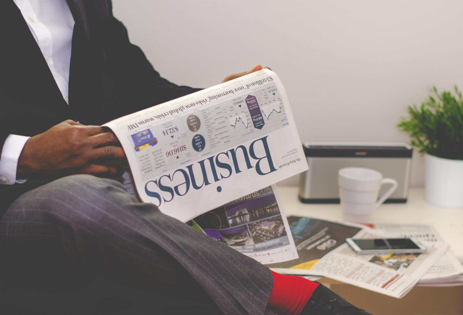 Man reading newspaper 