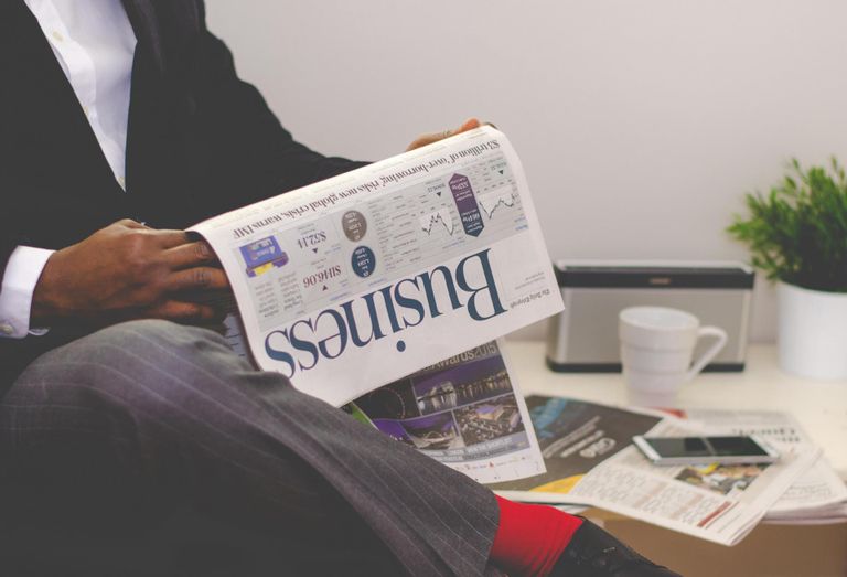 Man reading newspaper 