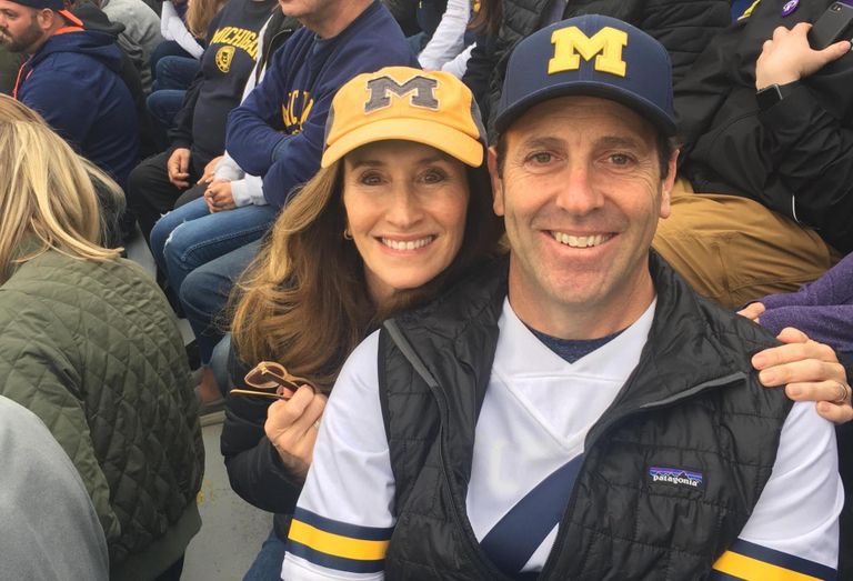 Lowe Executive Vice President, Retail Joel Mayer with wife Julie Mayer at a University of Michigan football game