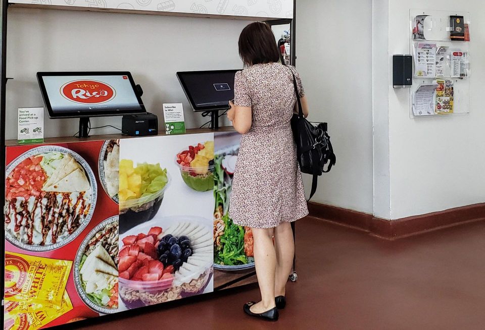 A woman orders at Kitchen United's Eats on Madison ghost kitchen location in Pasadena