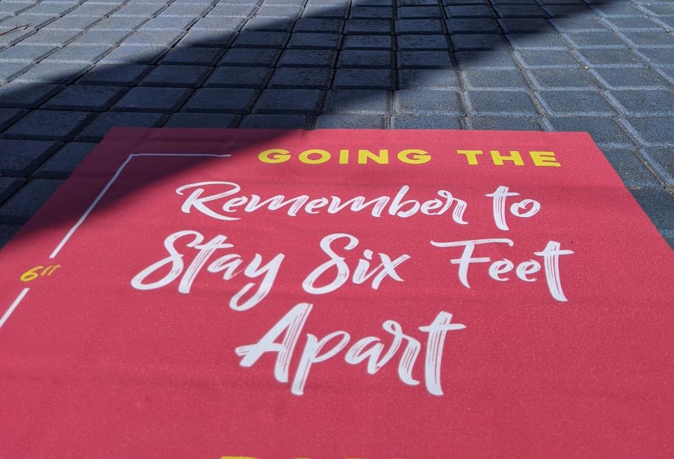 Signage on the floor of a retail shopping center