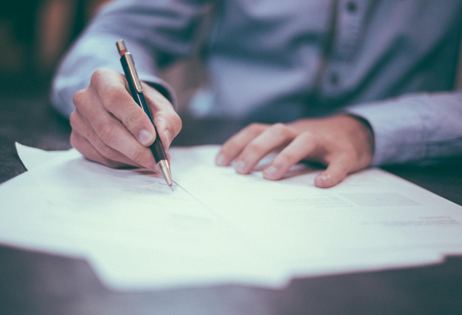 Man signing contract 