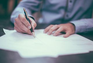 Man signing contract 