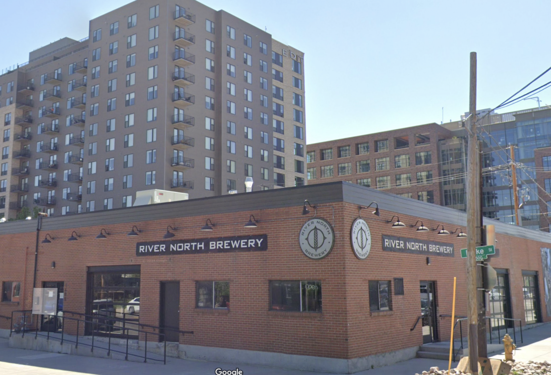 A Google Maps image of River North Brewery's Blake Street location in Denver with new high-rise multifamily development as a backdrop.