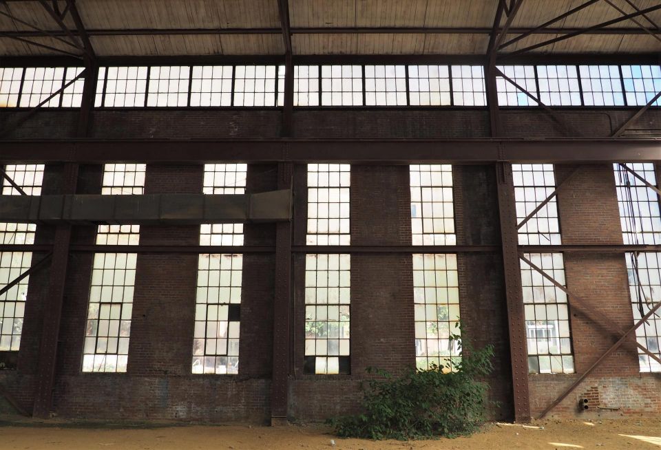 Interior of the historic electric sub-station at 200 Tingey St. SE showing brick walls and vertically-oriented window banks.