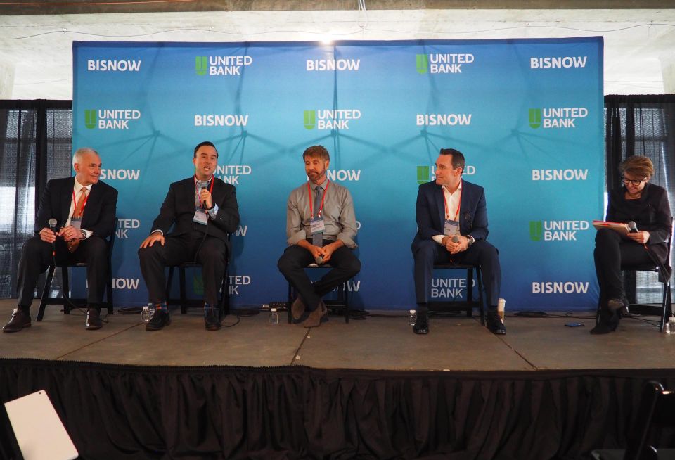 Jim Davis of Davis Construction, Jay Kelly of Fougler-Pratt, David von Storch of Urban Adventures & VIDA Fitness, Tim Steffan of Comstock and Rachel Flynn of Fairfax County speak during a panel at Bisnow's D.C. Major Projects Event on Feb. 16, 2023.