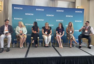 From left to right, speakers on a stage: Madison Rose's Adam Pines, Becknell Industrial's Paige Steers, Cushman & Wakefield's Sheila Acar, 1905 New Media's Kaysha Hanock, Stream Realty Partners' Marissa Rupert, Taylor Johnson Public Relations' Emily Johnson and Bisnow's Zak Guysenir.